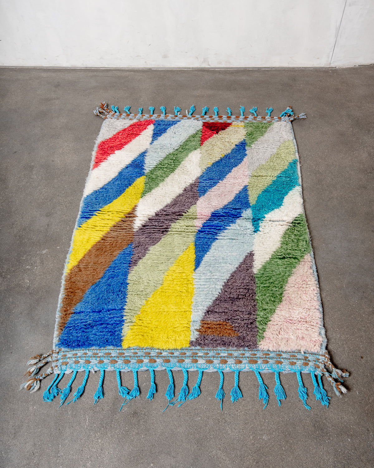 Modern, designer, handcrafted Berber rug from Morocco. Beniourain carpet with beautiful colours and patterns and fluffy wool texture.